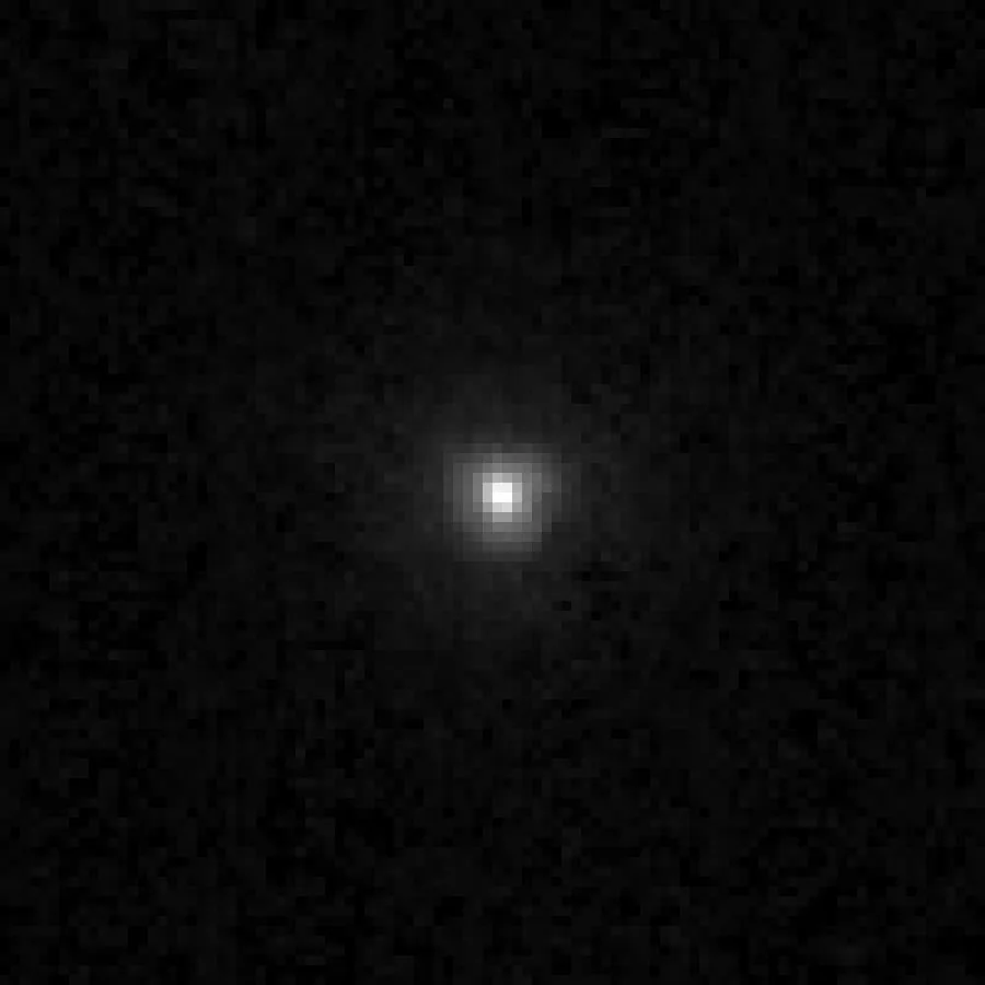 Chiron seen by Hubble on March 30, 1996: a bright nucleus inside a blurry halo. That halo is a coma, which means Chiron behaves like a comet
