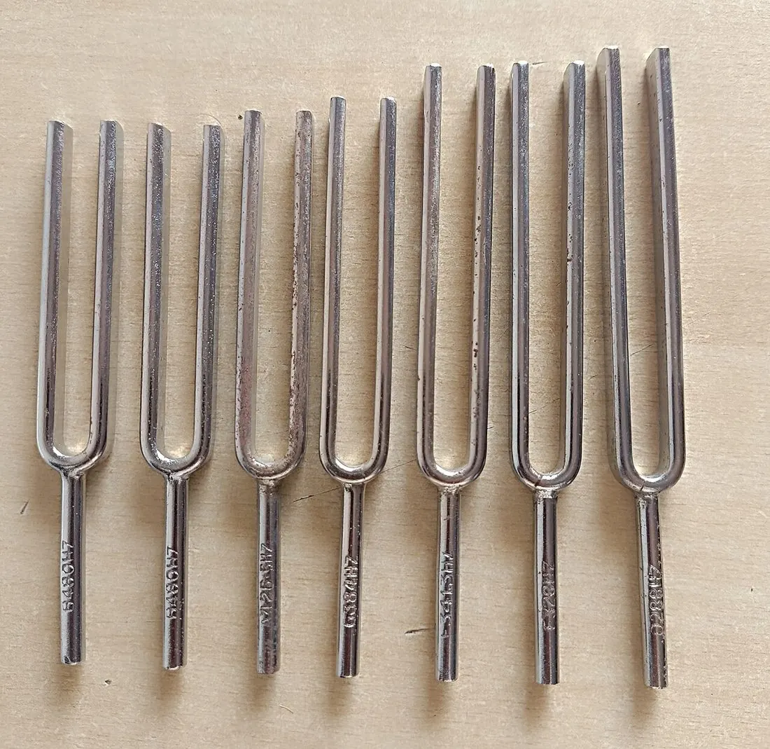 A set of tuning forks of different frequencies: the longer the prongs, the lower the tone