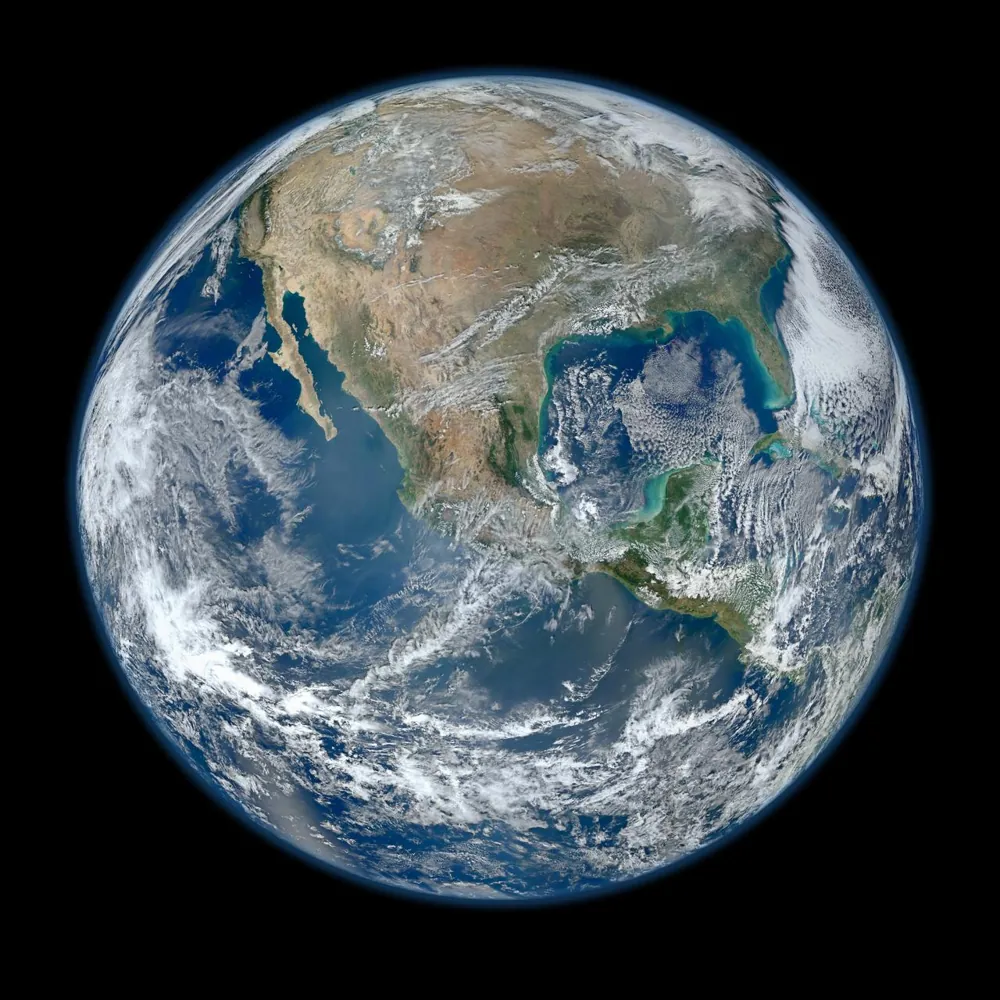 The whole Earth, the “Blue Marble”. Its orbit around the Sun is the Om tone