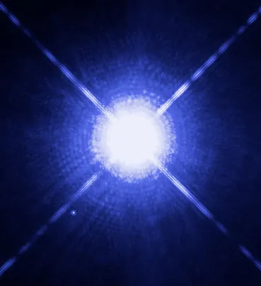 Sirius A and its white dwarf, Sirius B (the small dot at lower left). Their mutual orbit gives the frequency